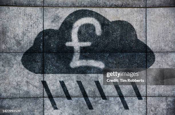 graffiti of rain cloud with pound symbol - divination stock pictures, royalty-free photos & images