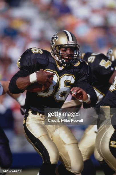 Stanford Jennings, Running Back for the New Orleans Saints in motion running the football during the American Football Conference West Division game...