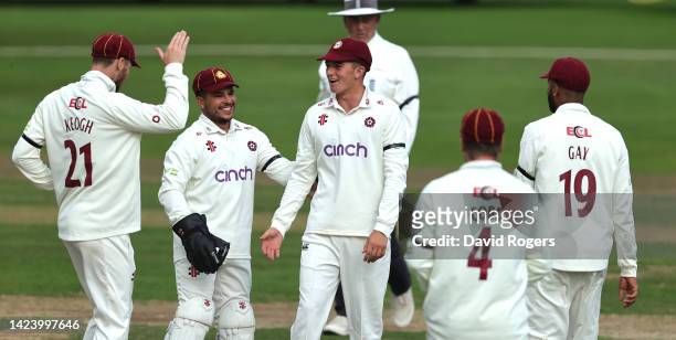 James Sales of Northamptonshire, is congratulated by team mates after running out Rory Burns during the LV= Insurance County Championship match...