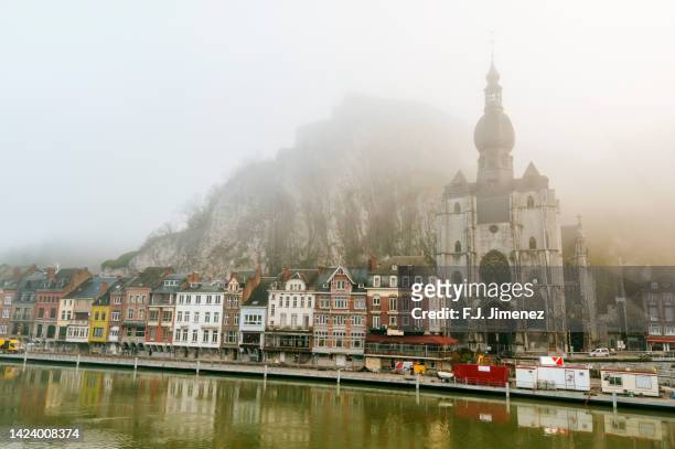 landscape of dinant village in belgium with fog - namur stock pictures, royalty-free photos & images