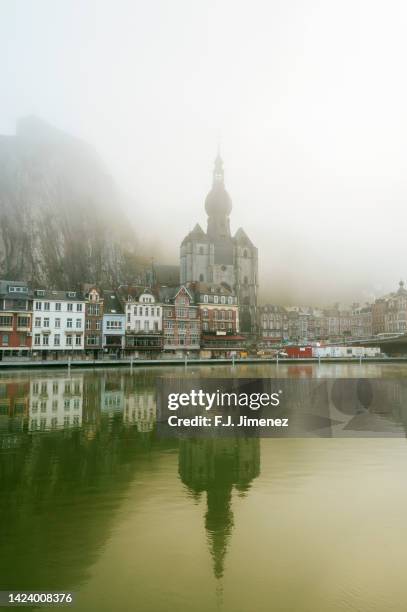 landscape of dinant village in belgium with fog - belgian culture stockfoto's en -beelden