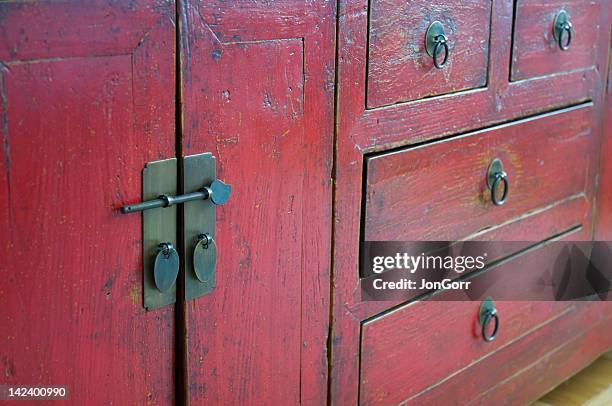 red wooden antique distressed cabinet with door pulls - kitchen dresser stock pictures, royalty-free photos & images