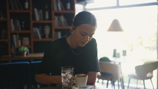 Close Up View Of Female In Casual Clothing Drinking Coffee In Bar