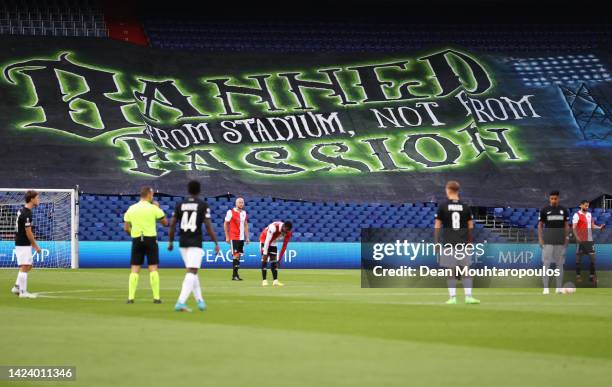 Banner saying 'Banned from stadium, not from passion' is seen on the stadium seats as fans are banned from the stadium during the UEFA Europa League...