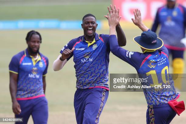 Jason Holder, David Miller and Kyle Mayers of Barbados Royals celebrate the wicket of Raymond Reifer of Jamaica Tallawahs during the Men's 2022 Hero...
