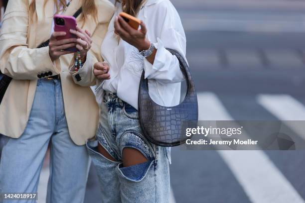 Fashion week visitor seen wearing Balenciaga shades, Loewe shirt and Coperni bag, outside PatBo Show during New York Fashion Week on September 10,...