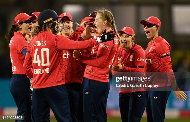 Sophie Ecclestone of England celebrates with teammates after dismissing Sneh Rana of India during the 3rd Vitality IT20 match between England and...