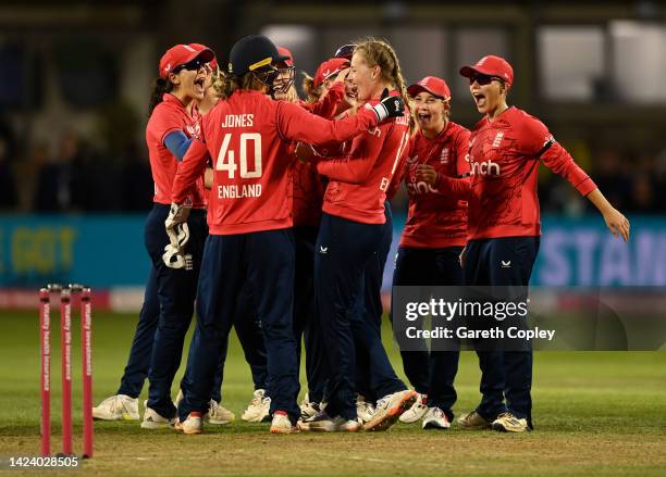 Sophie Ecclestone of England celebrates with teammates after dismissing Sneh Rana of India during the 3rd Vitality IT20 match between England and...