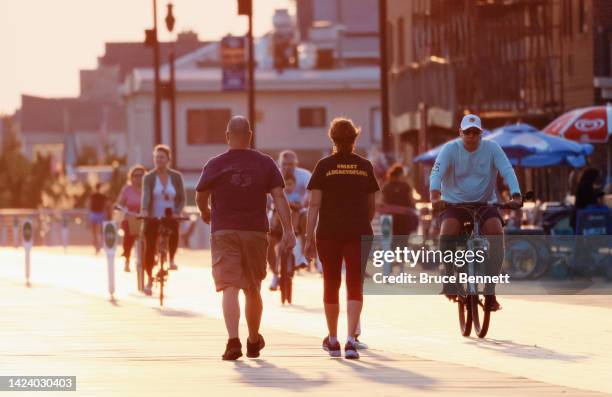 Visitors take to the boardwalk on Long Beach on September 14, 2022 in Long Beach, New York, United States. Temperatures continued to score in the...