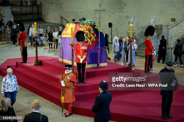 Members of the public file past after waiting to see the coffin of Queen Elizabeth II at Westminster Hall on September 15, 2022 in London, England....
