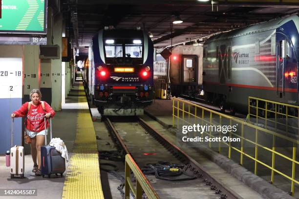 Passengers arrive on an Amtrak train at Union Station on September 15, 2022 in Chicago, Illinois. Amtrak, which preemptively canceled service along...