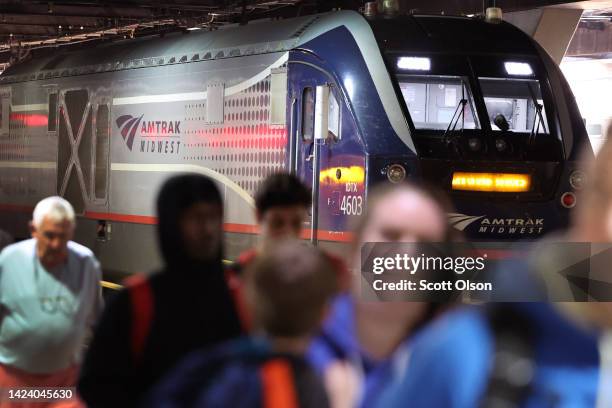 Passengers arrive on an Amtrak train at Union Station on September 15, 2022 in Chicago, Illinois. Amtrak, which preemptively canceled service along...