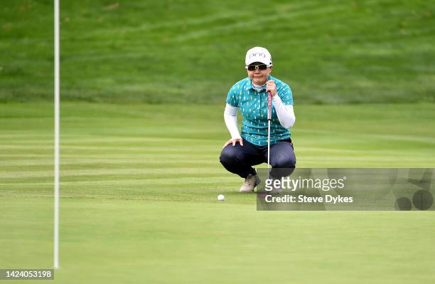 Ayako Uehara of Japan lines up her putt on the 12th hole during round one of the AmazingCre Portland Classic at Columbia Edgewater Country Club on...