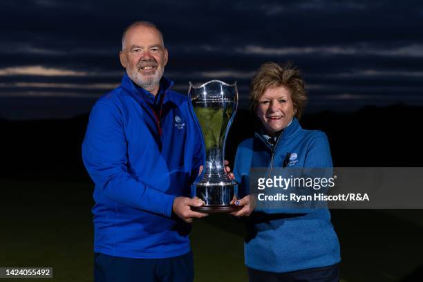 Ronnie Clark, Team Captain of Scotland Men, poses for a photograph with the inaugural R&A Women's & Men's Senior Home Internationals Trophy and Fiona...