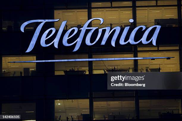 An illuminated logo is seen outside the headquarters of Telefonica SA in Madrid, Spain, on Tuesday, April 3, 2012. Telefonica SA, the Spanish phone...
