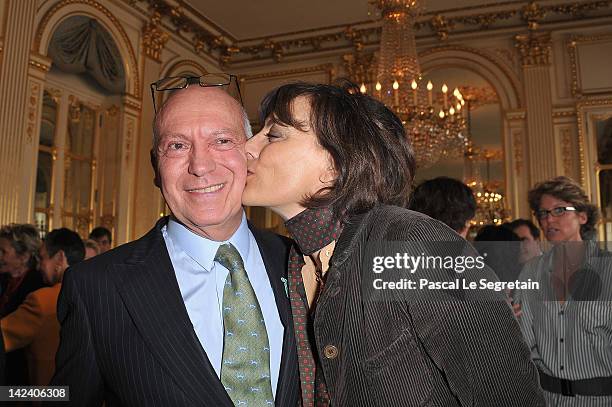 Bertrand Rindoff Petroff Officier des Arts et Des Lettres honored Chevalier Des Arts et Lettres by French Culture Minister is kissed by Ines De La...