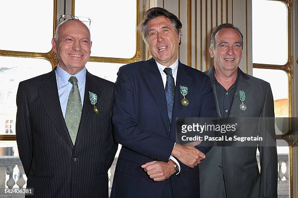 Bertrand Rindoff Petroff Officier des Arts et Des Lettres , Bryan Ferry and Yves Lecoq pose after being awarded by French Culture Minister at...
