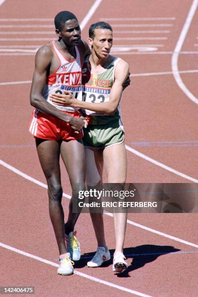 Athletes Kenyan Paul Ereng hugs Morocco Said Aouita after winning the