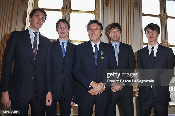 Brian Ferry poses with his sons from Left to right Otis, Merlin, Isaac and Tara after being awarded Officier Des Arts Et Des Lettres at Ministere de...