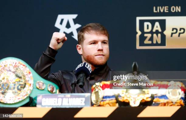 Undisputed super middleweight champion Canelo Alvarez raises a fist during a news conference at the KA Theatre at MGM Grand Hotel & Casino on...