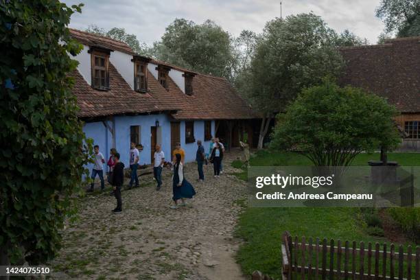 Tourists visit the house of King Charles III, which is open to visitors, on September 15, 2022 in Viscri, Romania. The village of Viscri is a UNESCO...