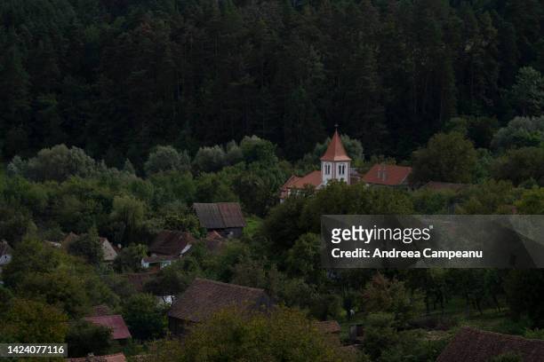 View of houses and the Orthodox church on September 15, 2022 in Viscri, Romania. The village of Viscri is a UNESCO World Heritage site known for its...
