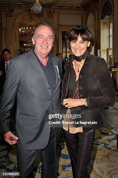 Yves Lecoq poses with Ines De La Fressange after being awarded by French Culture Minister at Ministere de la Culture on April 4, 2012 in Paris,...