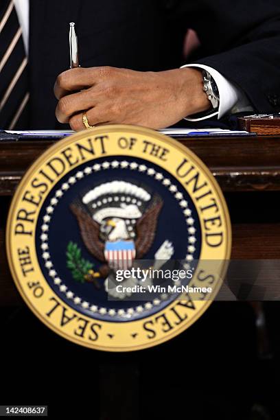 President Barack Obama signs the STOCK Act into law at the Eisenhower Executive Office Building April 4, 2012 in Washington, DC. The STOCK Act is a...