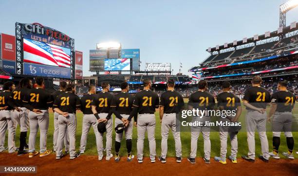 The Pittsburgh Pirates stand during the national anthem before a game against the New York Mets at Citi Field on September 15, 2022 in New York City....