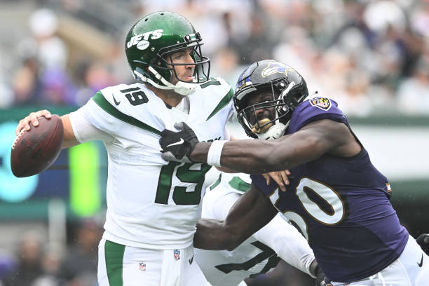 Justin Houston of the Baltimore Ravens sacks Joe Flacco of the New York Jets during the game at MetLife Stadium on September 11, 2022 in East...