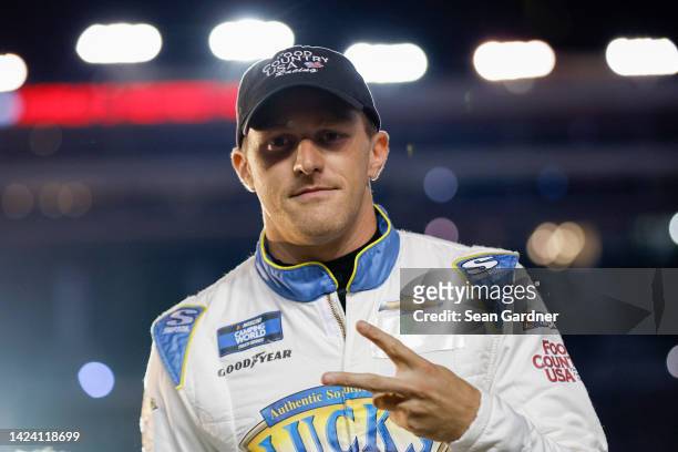 Parker Kligerman, driver of the Luck's Beans/Food Country USA Toyota, walks onstage during driver intros prior to the NASCAR Camping World Truck...