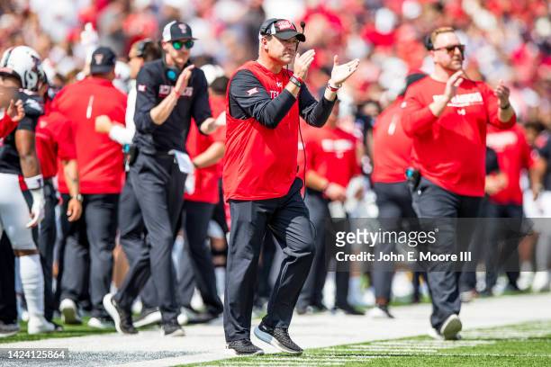 Head coach Joey McGuire of the Texas Tech Red Raiders walks onto the field during the first half of the game against the Houston Cougars at Jones...