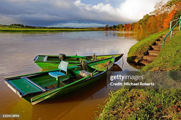 salmon fishing boats on river tweed - michael kelso stock pictures, royalty-free photos & images