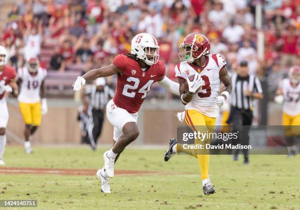 Wide receiver Jordan Addison of the USC Trojans carries the ball after a pass reception during a Pac-12 college football game against the Stanford...
