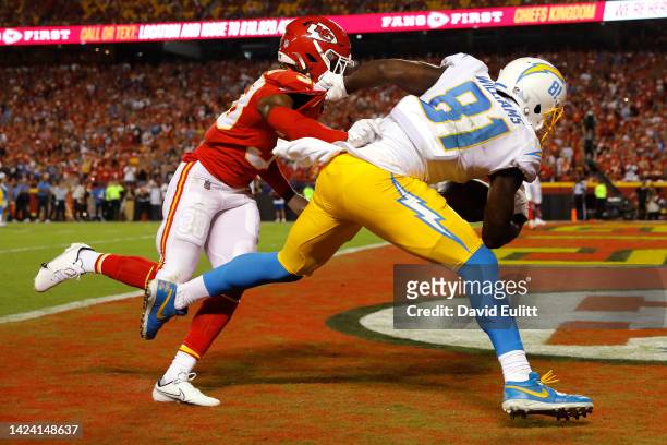 Mike Williams of the Los Angeles Chargers catches the ball in front of L'Jarius Sneed of the Kansas City Chiefs for a touchdown during the third...