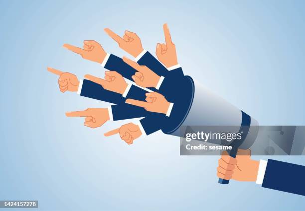 international propaganda, strong condemnation, angry businessman holding megaphone talking and complaining and countless accusing hands sticking out of megaphone - having a suspicion stock illustrations