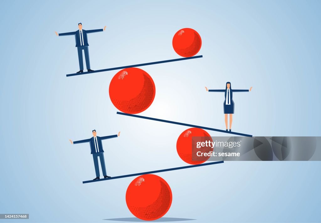 Iron balls of different sizes and weights keep a consistent balance of businessman standing on a superimposed seesaw, balance concept, business balance concept