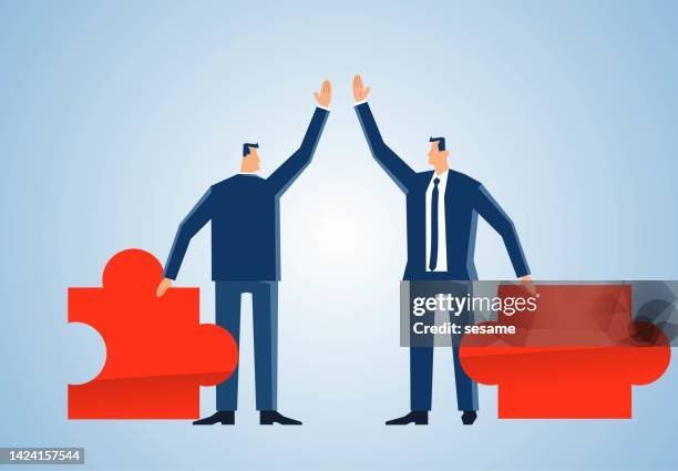 two businessmen holding puzzle pieces and high five each other, cooperation, partners, reaching an agreement, teamwork support each other and achieve success concept - integrated marketing strategy stock illustrations