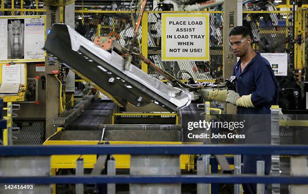 Local 588 assembly worker moves automobile parts at Ford Motor Company's Chicago Stamping Plant April 4, 2012 in Chicago Heights, Illinois. U.S....