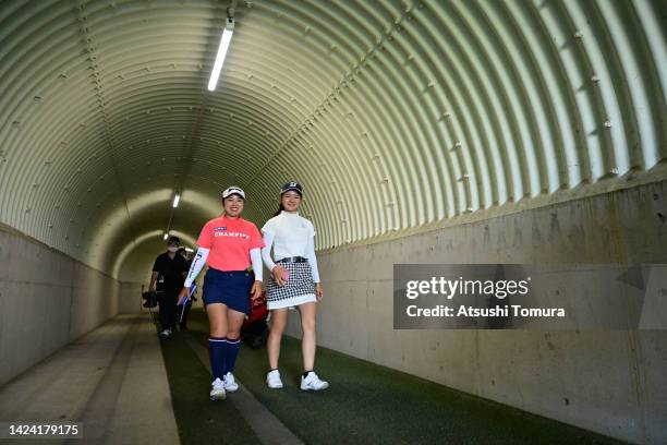 Miyuu Yamashita and Haruka Kawasaki of Japan walk through the tunnel during the first round of Sumitomo Life Vitality Ladies Tokai Classic at Shin...
