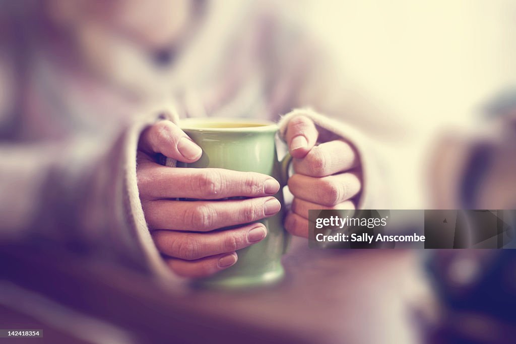 Woman with mug of tea