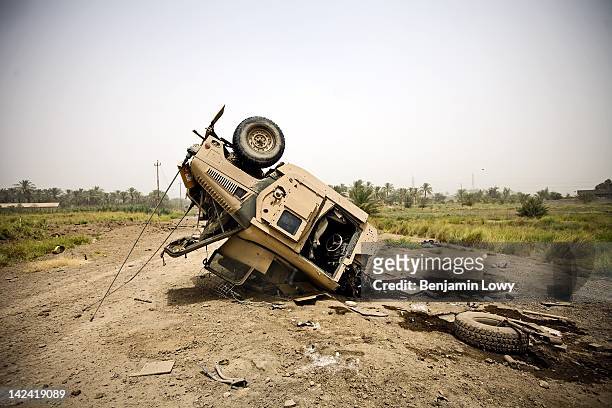 The remains of an American Humvee, one of four that were disable by massive IEDs, lies on a dirt road on August 4, 2007 in Hawr Rajab, Iraq.