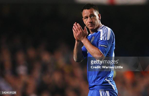 John Terry of Chelsea applauds the fans as he leaves the field during the UEFA Champions League Quarter Final second leg match between Chelsea and...