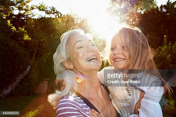 portrait of grandmother and girl (4 - 5 y) - enkelkind stock-fotos und bilder