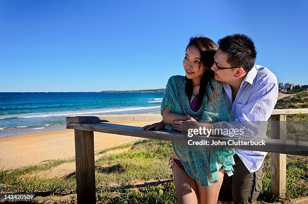 aussie asian couple at the beach - australia chinese stock pictures, royalty-free photos & images