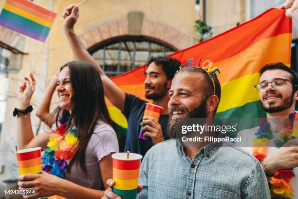 people dancing and having fun together at an lgbtqia pride event party - light festival parade stock pictures, royalty-free photos & images