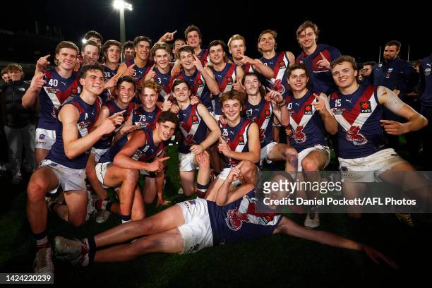 The Dragons pose for a team photo after winning the NAB League Grand Final match between the Sandringham Dragons and the Dandenong Stingrays at Ikon...