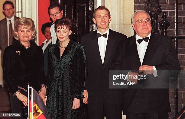 German Chancellor Helmut Kohl and his wife Hannelore are greeted by British Prime Minister Tony Blair and wife Cherie 18 February at No. 10 Downing...