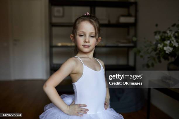 portrait of confident girl wearing tutu at home - ballet dancers russia stock pictures, royalty-free photos & images