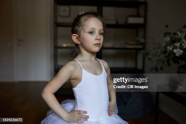 portrait of serious girl wearing tutu at home - ballet girl stock pictures, royalty-free photos & images